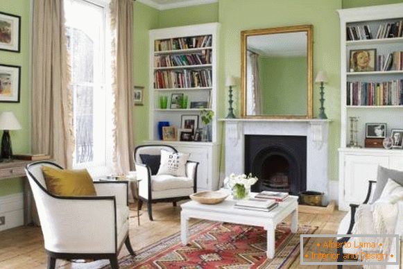 Interior verde da sala de estar com móveis brancos