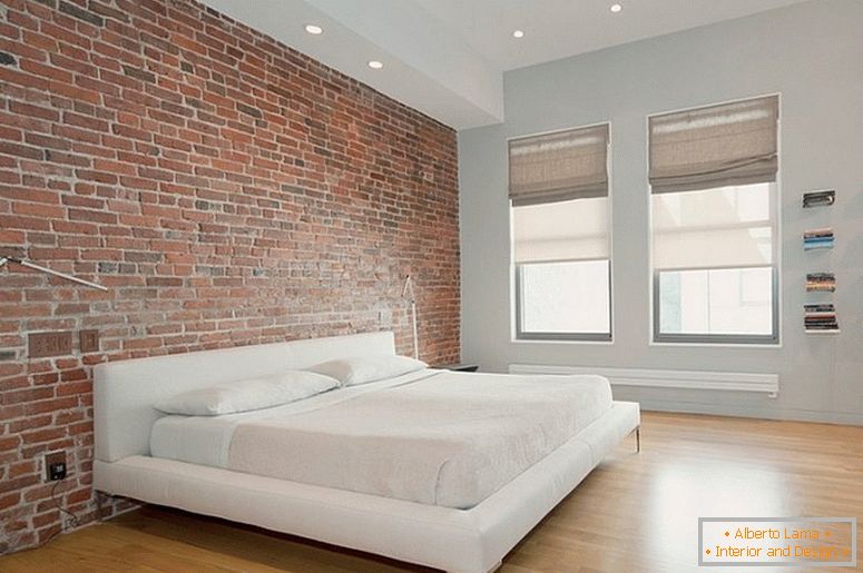 Interior no estilo do minimalismo com uma parede de tijolos