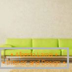 Interior em estilo minimalista com um sofá verde claro