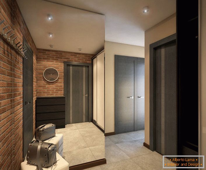 O projeto de design do corredor é uma versão elegante do estilo loft (parede de tijolos) e a cor de um nobre wenge.