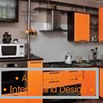 Cozinha elegante na cor preta e laranja