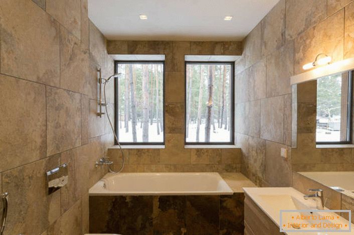 Uma solução invulgar para o design da casa de banho no estilo minimalista é a utilização para acabamento de ladrilhos cerâmicos, imitando a textura da pedra natural.