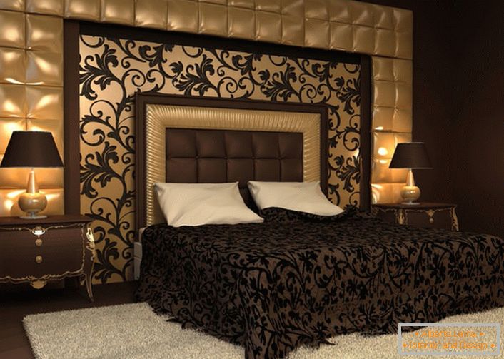 O destaque da solução de design foi o encosto na cabeceira da cama e na parede, coberto com um pano macio. Ornamentos na colcha ecoam com ornamentos no painel da parede. 